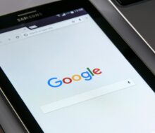Close-up of a tablet displaying Google's search screen, emphasizing technology and internet browsing.